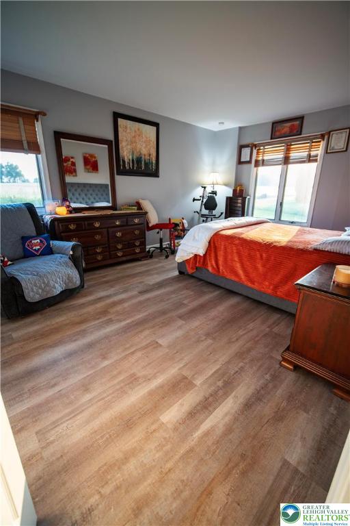443 Vera Circle, Unit K Bethlehem, PA 18017 - Photo 17 of 24 a bedroom with furniture and a flat screen tv