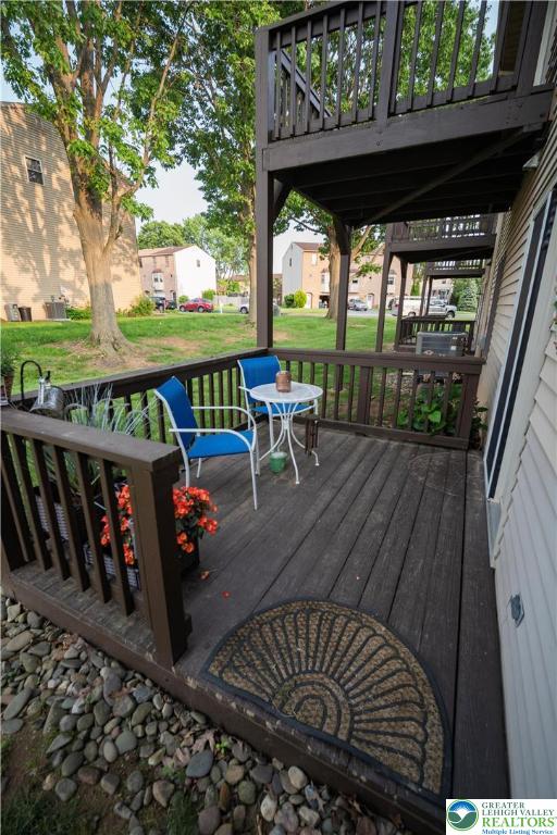 443 Vera Circle, Unit K Bethlehem, PA 18017 - Photo 21 of 24 a view of a patio with wooden floor chairs and table