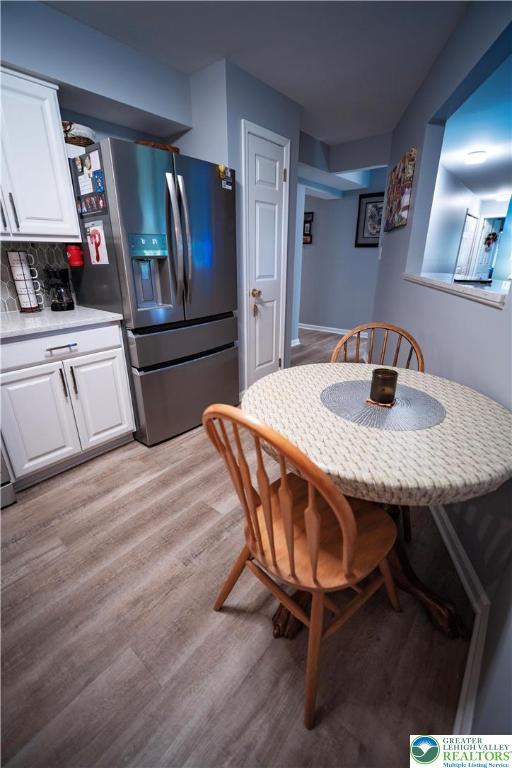 443 Vera Circle, Unit K Bethlehem, PA 18017 - Photo 5 of 24 a kitchen with granite countertop a wooden floor and a refrigerator
