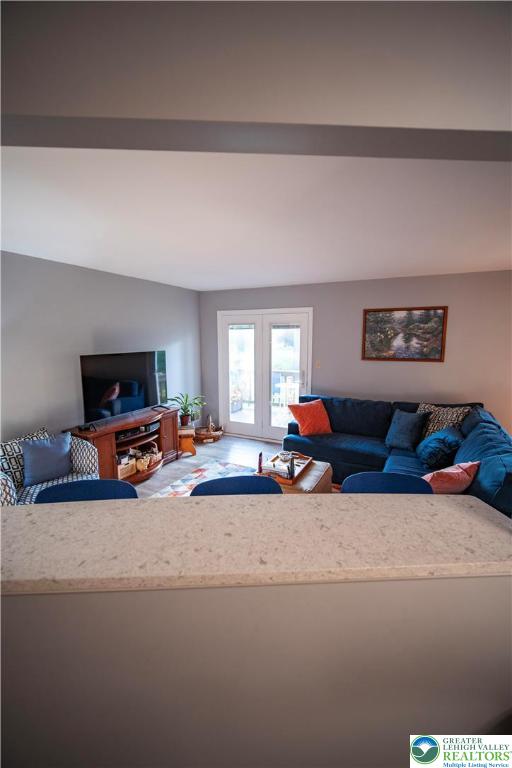 443 Vera Circle, Unit K Bethlehem, PA 18017 - Photo 7 of 24 a living room with furniture and a flat screen tv