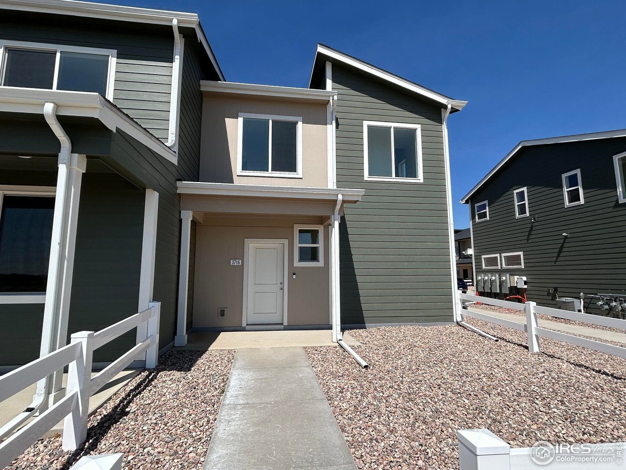 3716 Pinnacles Court Evans, CO 80620 - Photo 1 of 9 a front view of a house with stairs