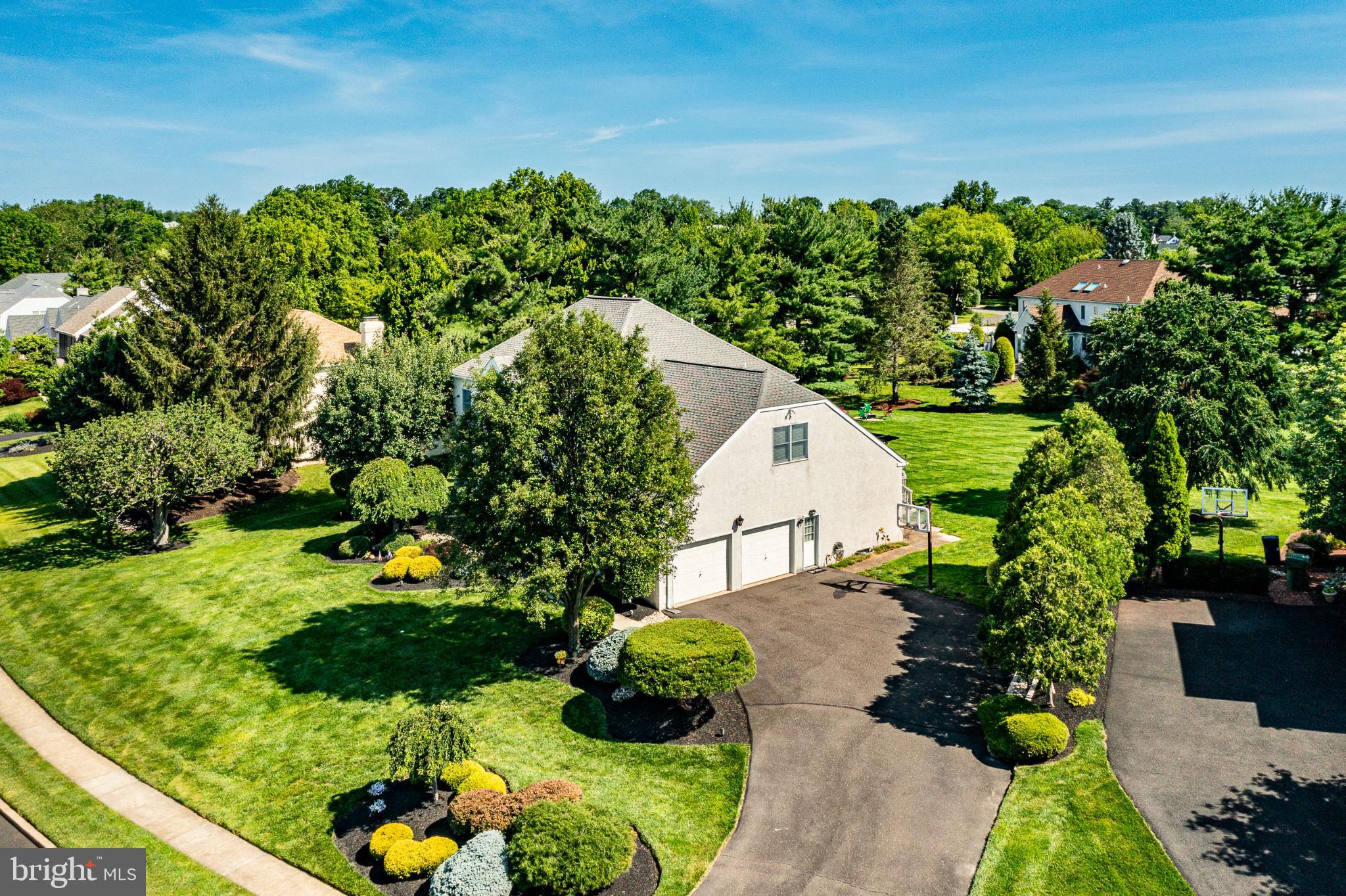 1716 St Georges Road Dresher, PA 19025 - Photo 22 of 90 Lush greenery surrounds a charming home.