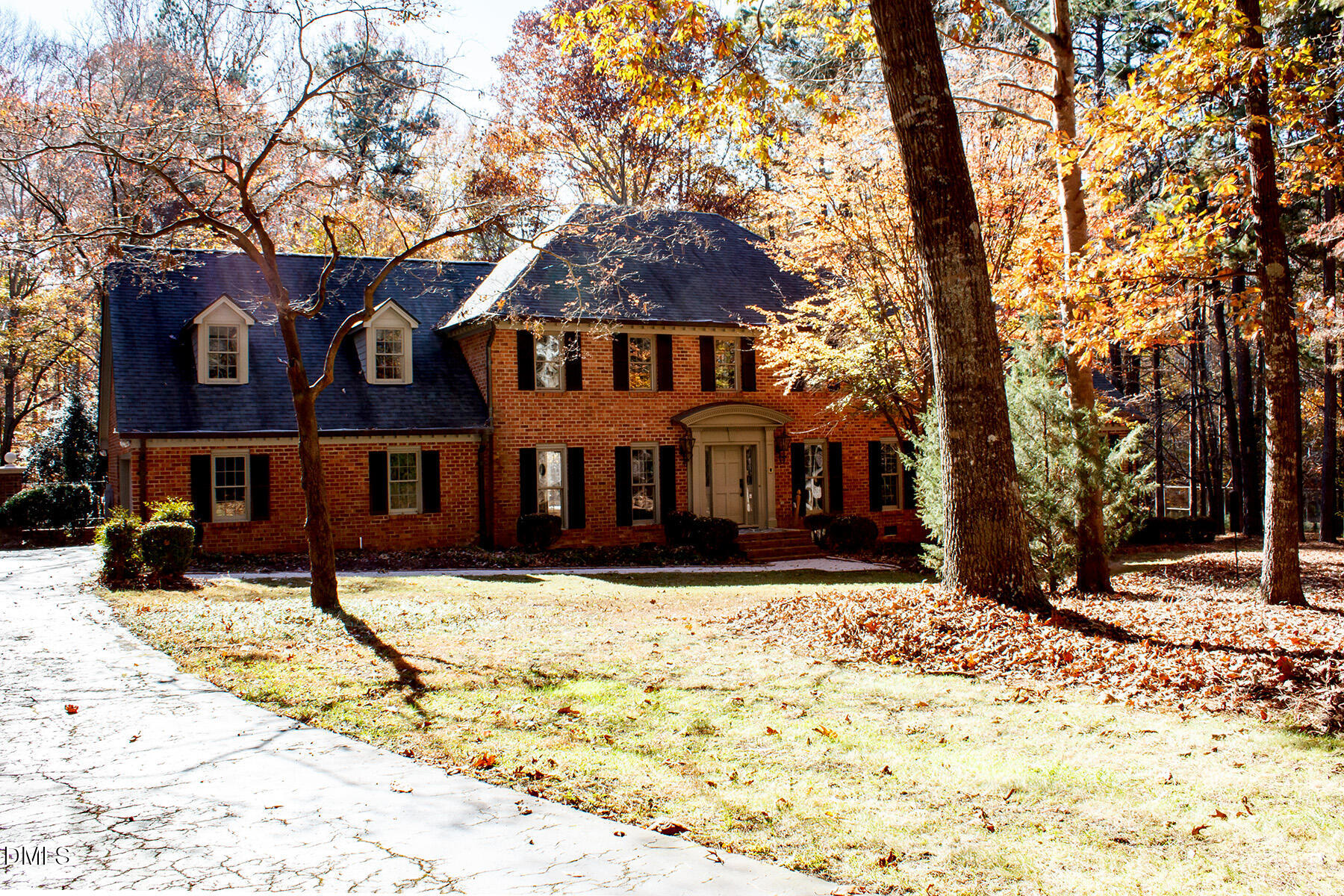 14263 Wyndfield Circle Raleigh, NC 27615 - Photo 14 of 74 a front view of a house with a yard covered in snow