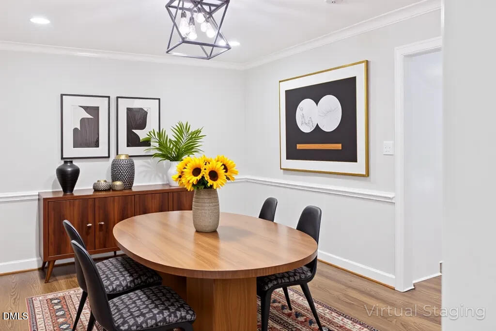 14263 Wyndfield Circle Raleigh, NC 27615 - Photo 25 of 74 a view of a dining room with furniture and wooden floor