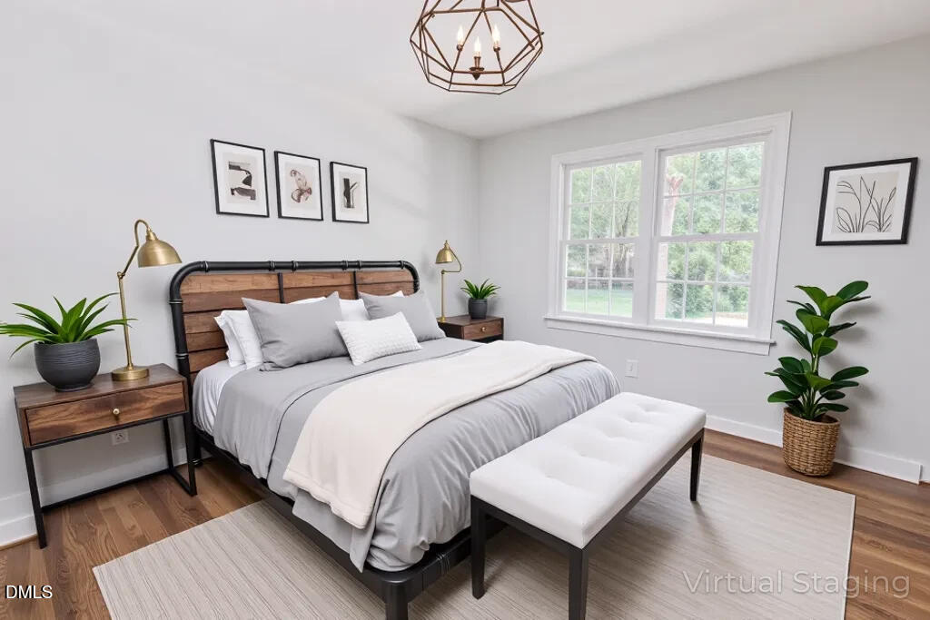 14263 Wyndfield Circle Raleigh, NC 27615 - Photo 26 of 74 a bedroom with a bed a couch and a potted plant