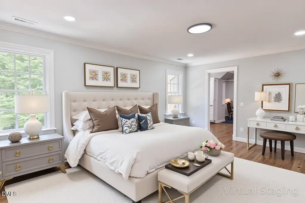 14263 Wyndfield Circle Raleigh, NC 27615 - Photo 27 of 74 a bedroom with a bed and wooden floor