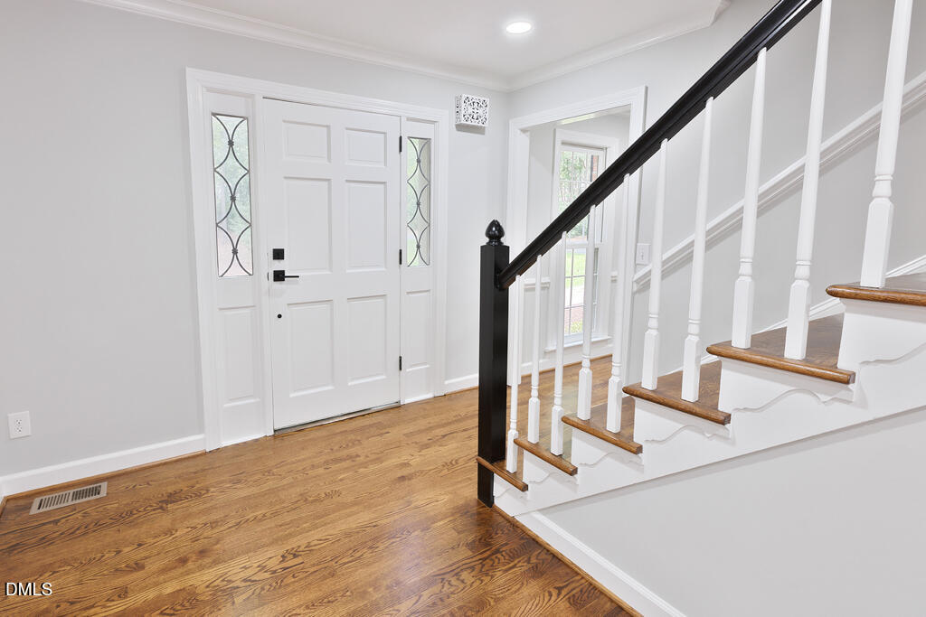 14263 Wyndfield Circle Raleigh, NC 27615 - Photo 28 of 74 a view of an entryway with wooden floor and staircase
