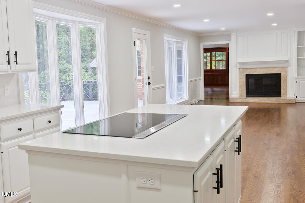 14263 Wyndfield Circle Raleigh, NC 27615 - Photo 37 of 74 a kitchen with a stove a sink and a refrigerator with white cabinets