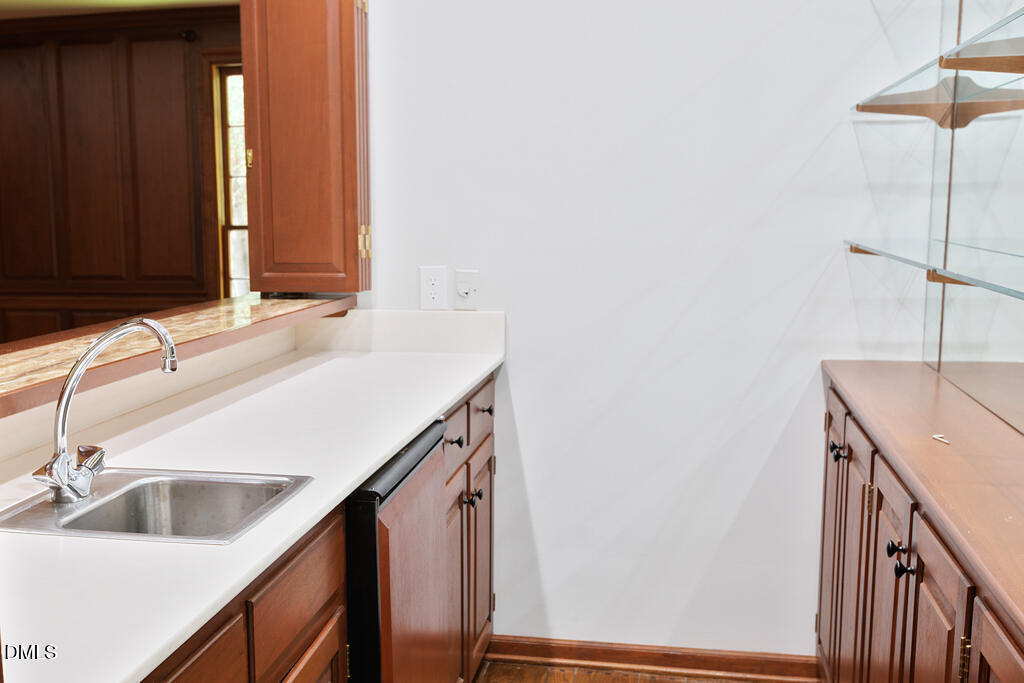 14263 Wyndfield Circle Raleigh, NC 27615 - Photo 42 of 74 a bathroom with a sink and a mirror