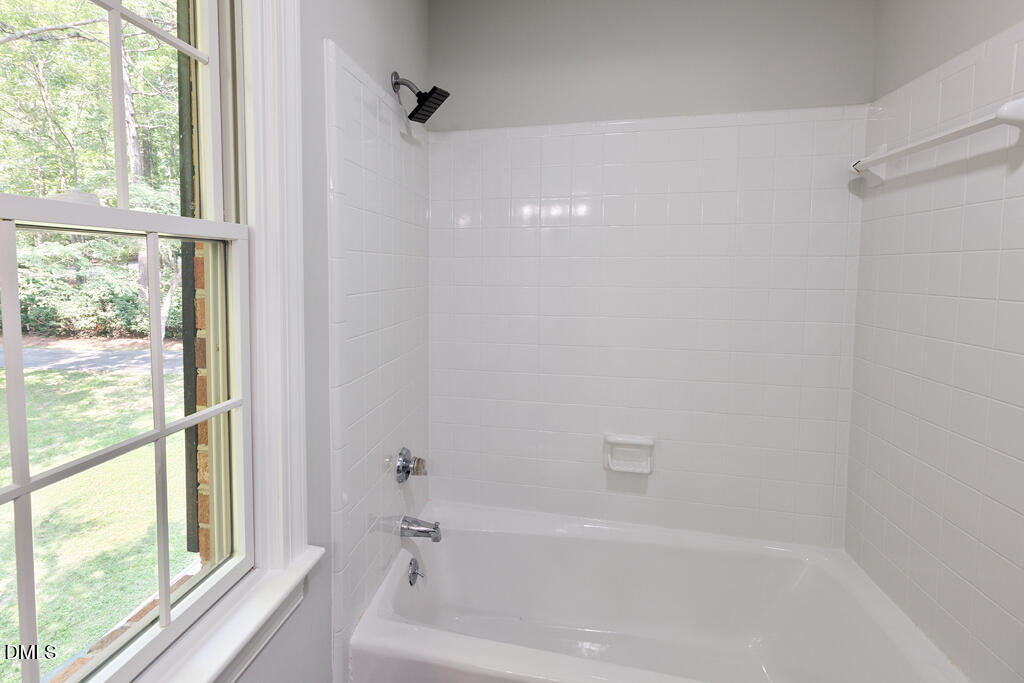 14263 Wyndfield Circle Raleigh, NC 27615 - Photo 63 of 74 a bathroom with a bathtub