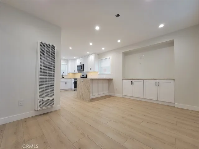 a view of kitchen with wooden floor