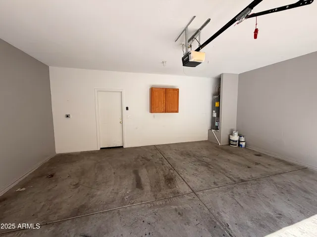 a view of a livingroom with wooden floor and windows
