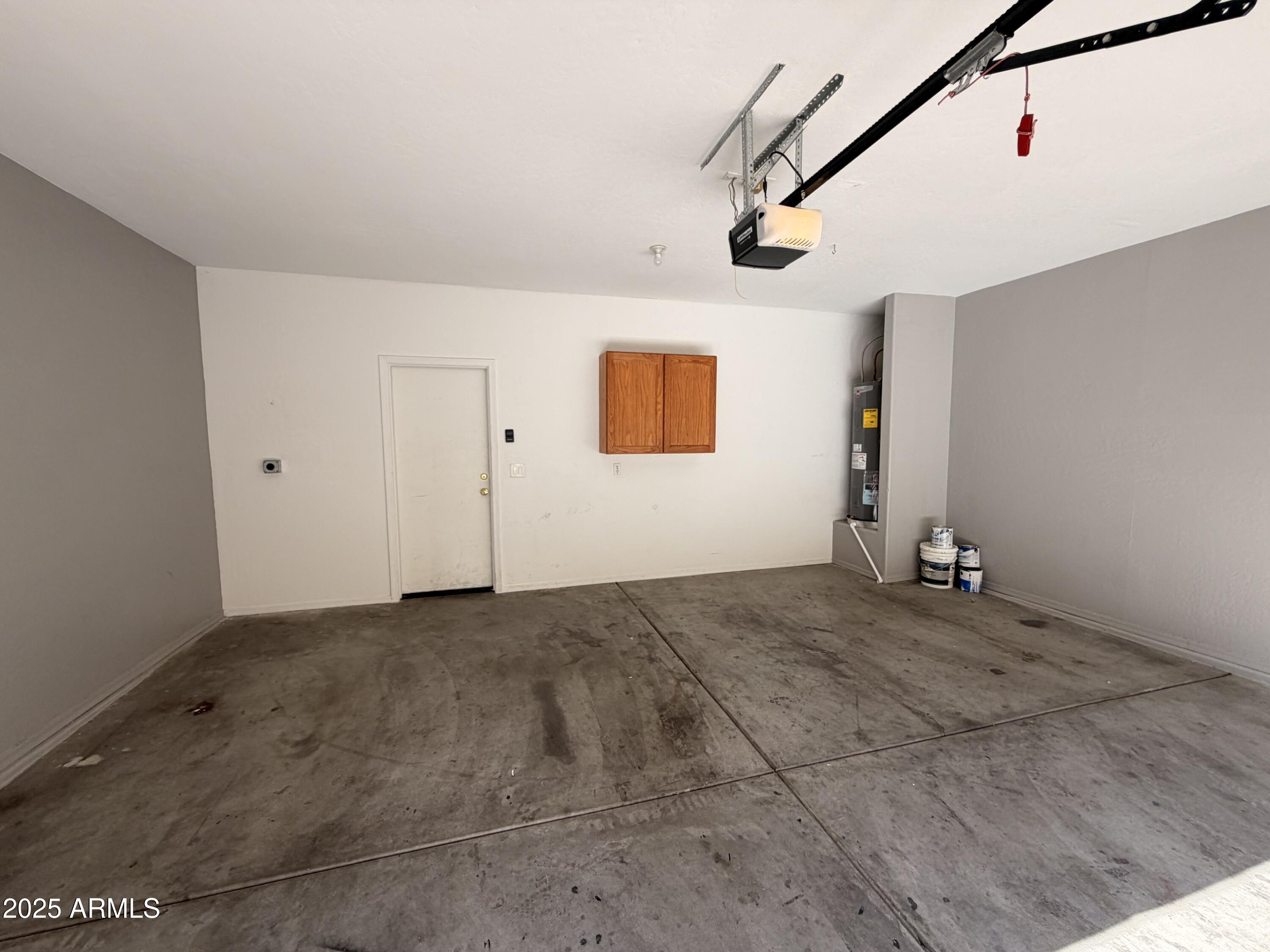 10027 West Payson Road Tolleson, AZ 85353 - Photo 17 of 18 a view of a livingroom with wooden floor and windows