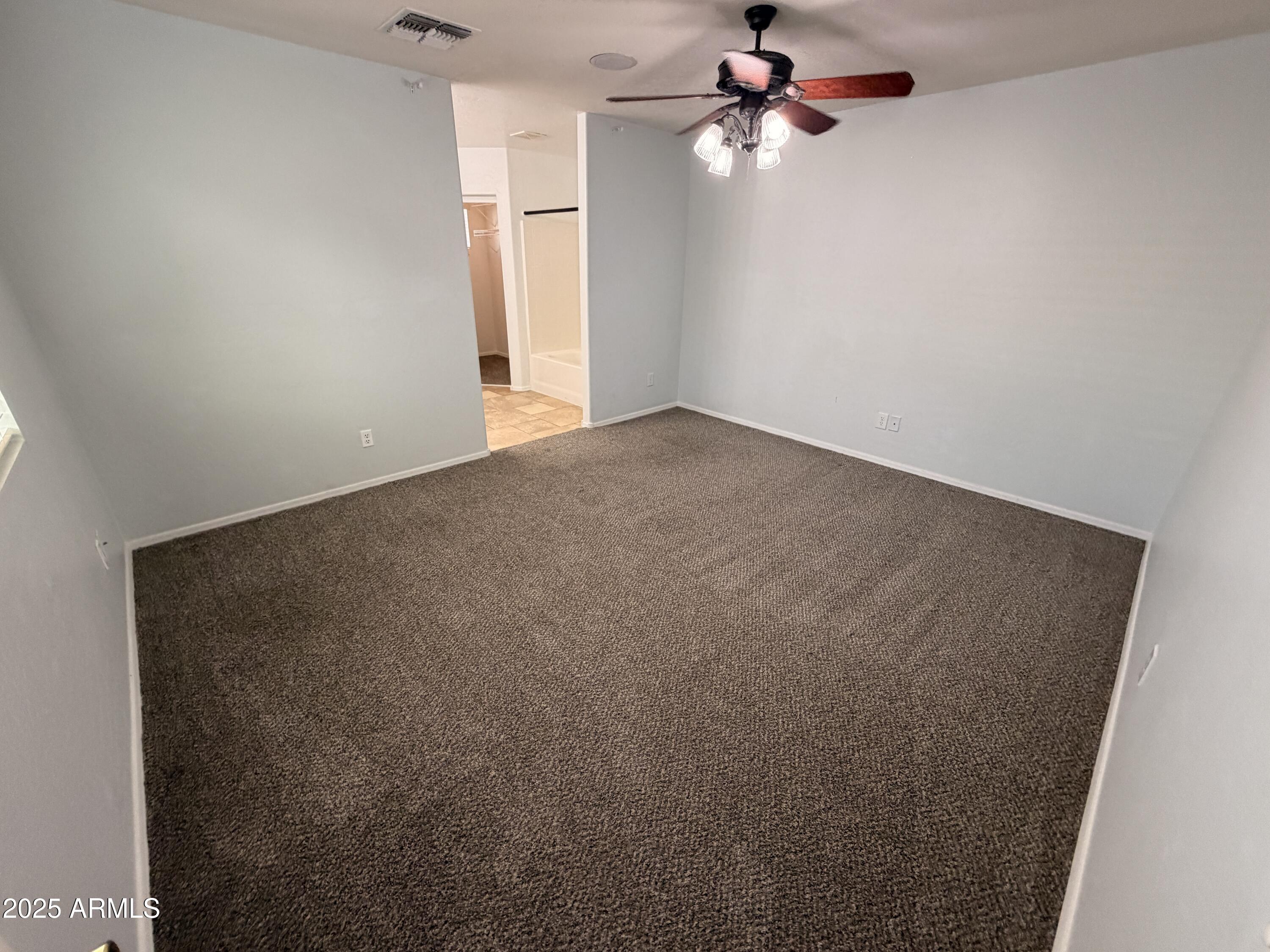 10027 West Payson Road Tolleson, AZ 85353 - Photo 8 of 18 an empty room with a window