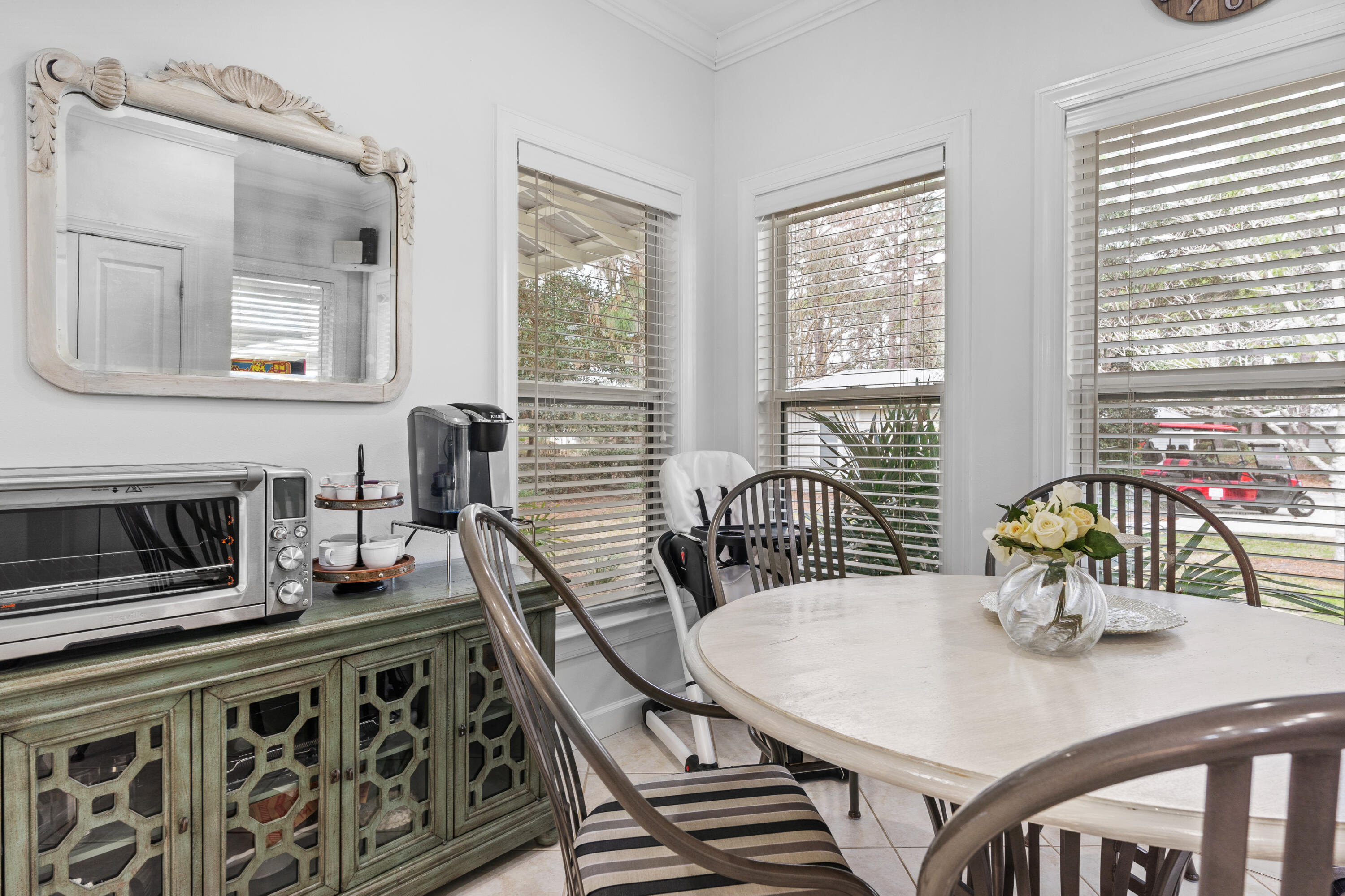 Undisclosed Address Miramar Beach, FL 32550 - Photo 15 of 51 a view of a dining room with furniture window and wooden floor