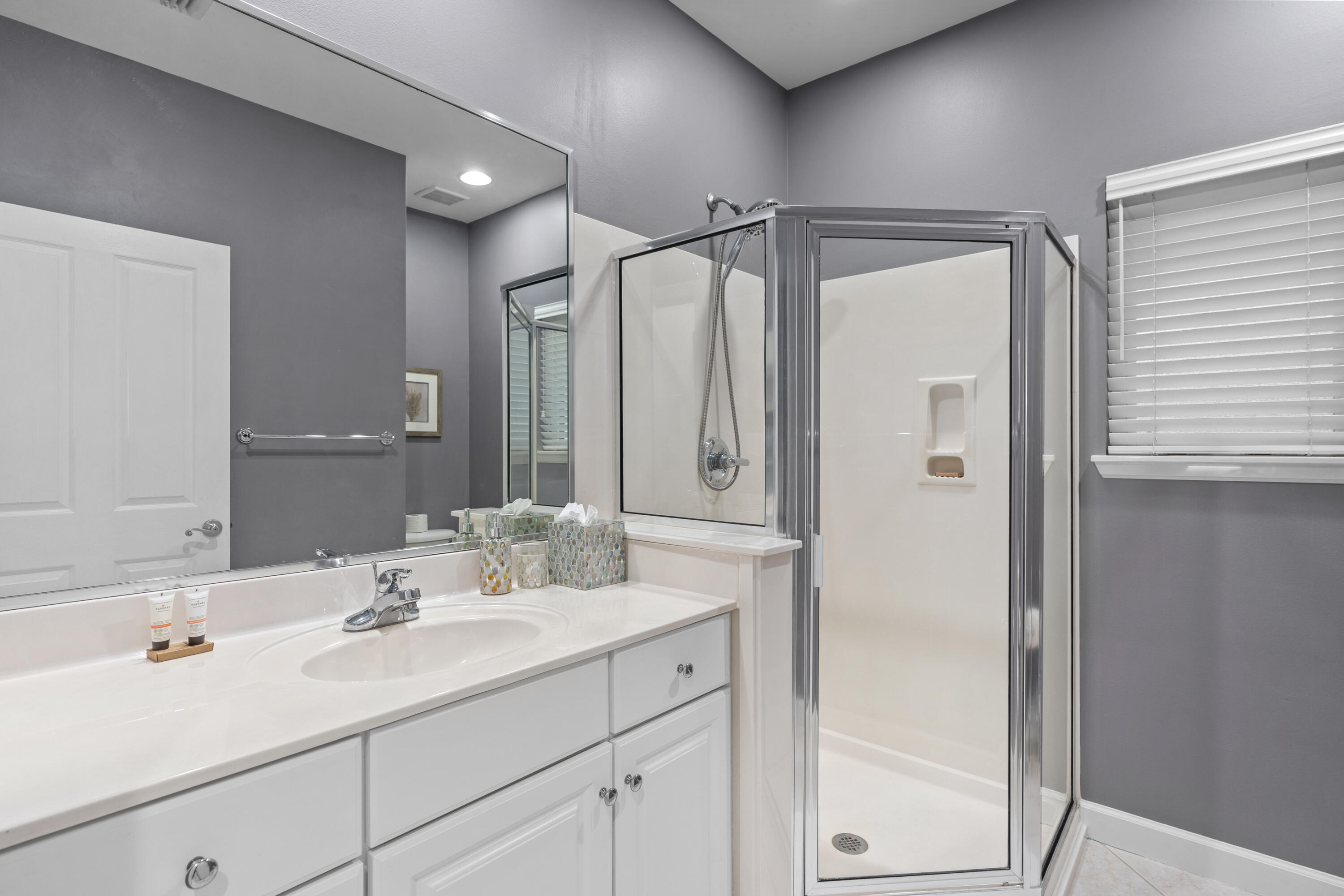 Undisclosed Address Miramar Beach, FL 32550 - Photo 28 of 51 a bathroom with a sink double vanity and a mirror