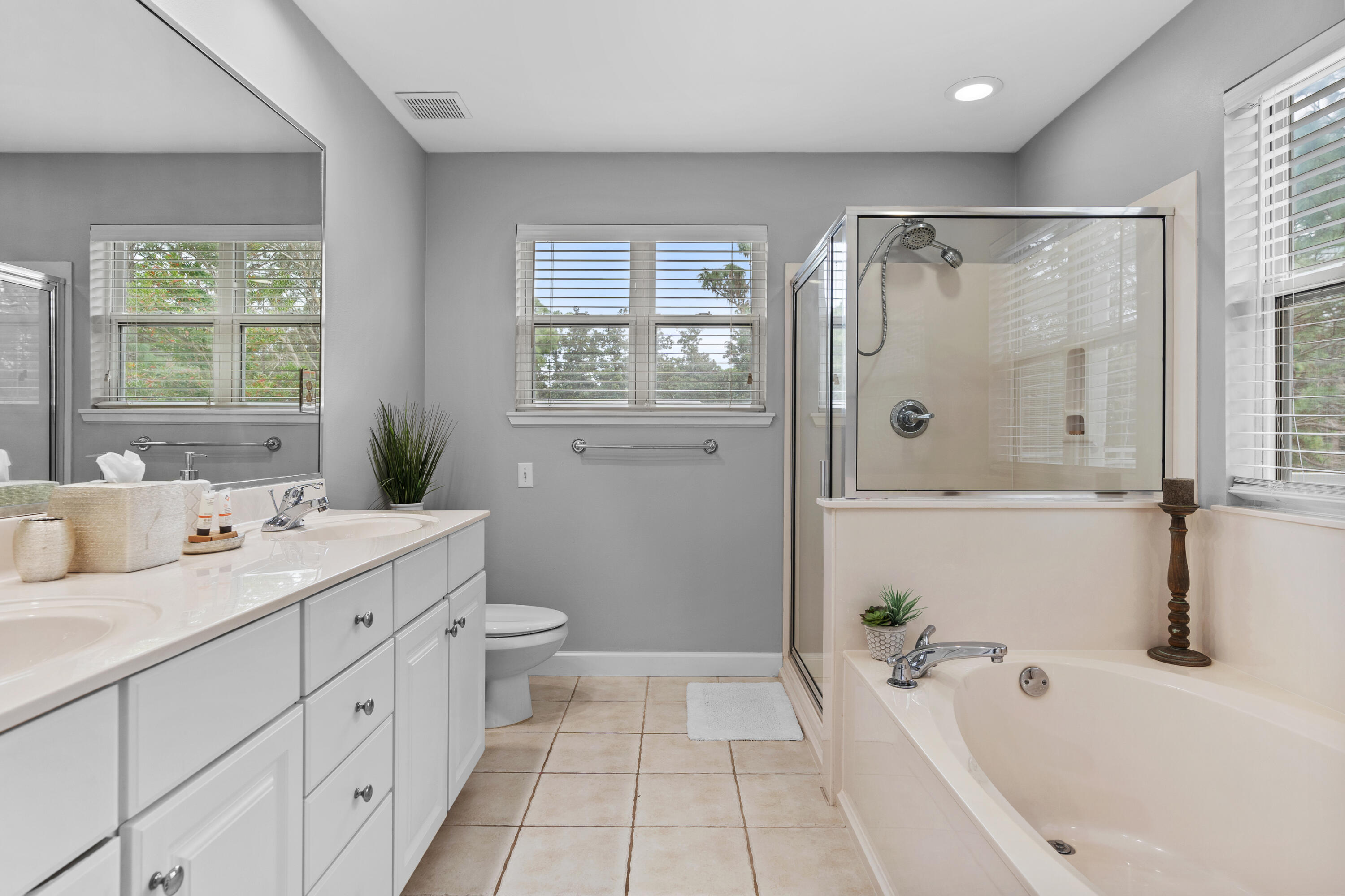 Undisclosed Address Miramar Beach, FL 32550 - Photo 34 of 51 a bathroom with a tub sink and mirror