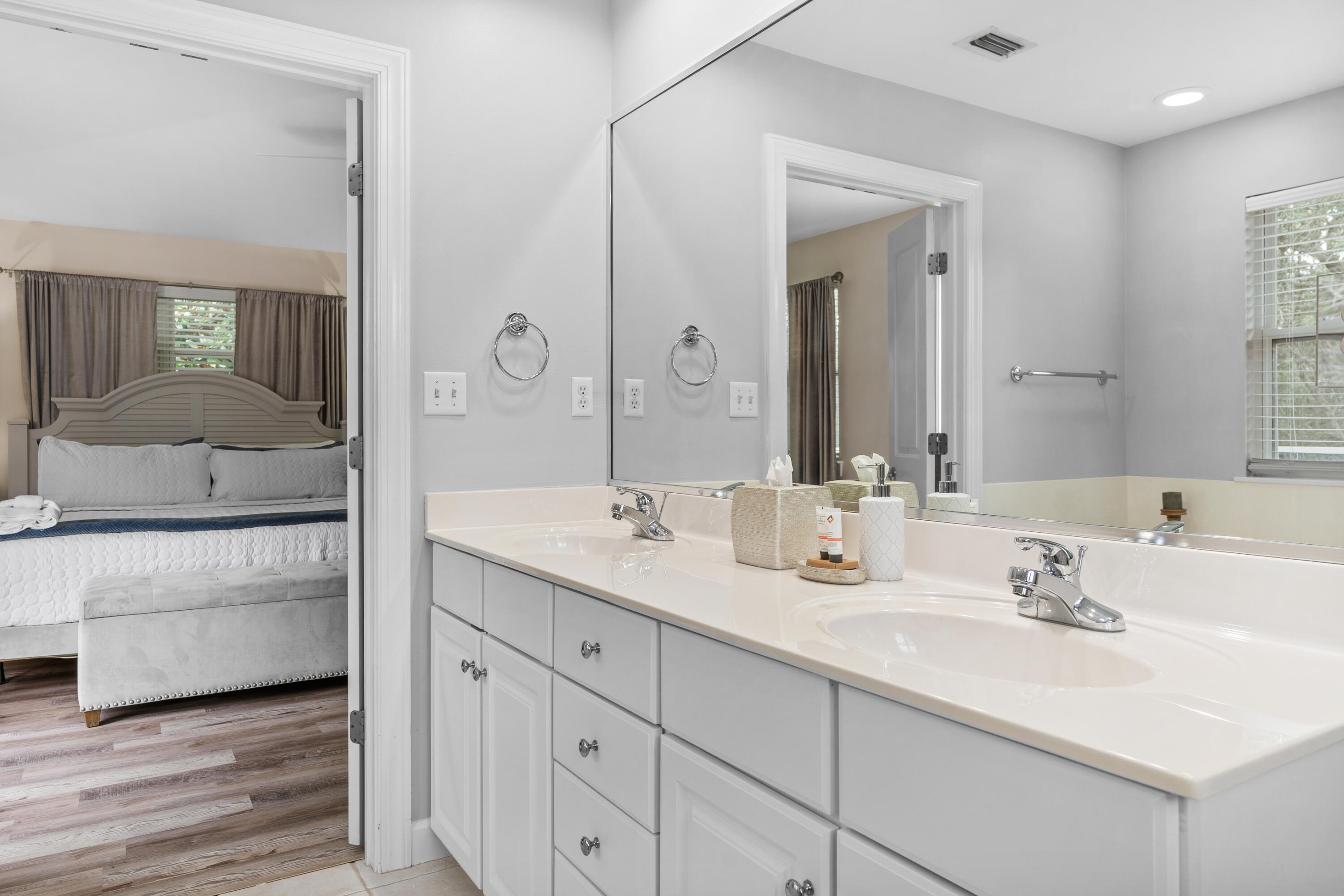 Undisclosed Address Miramar Beach, FL 32550 - Photo 35 of 51 a en suite bathroom with double sink and a mirror