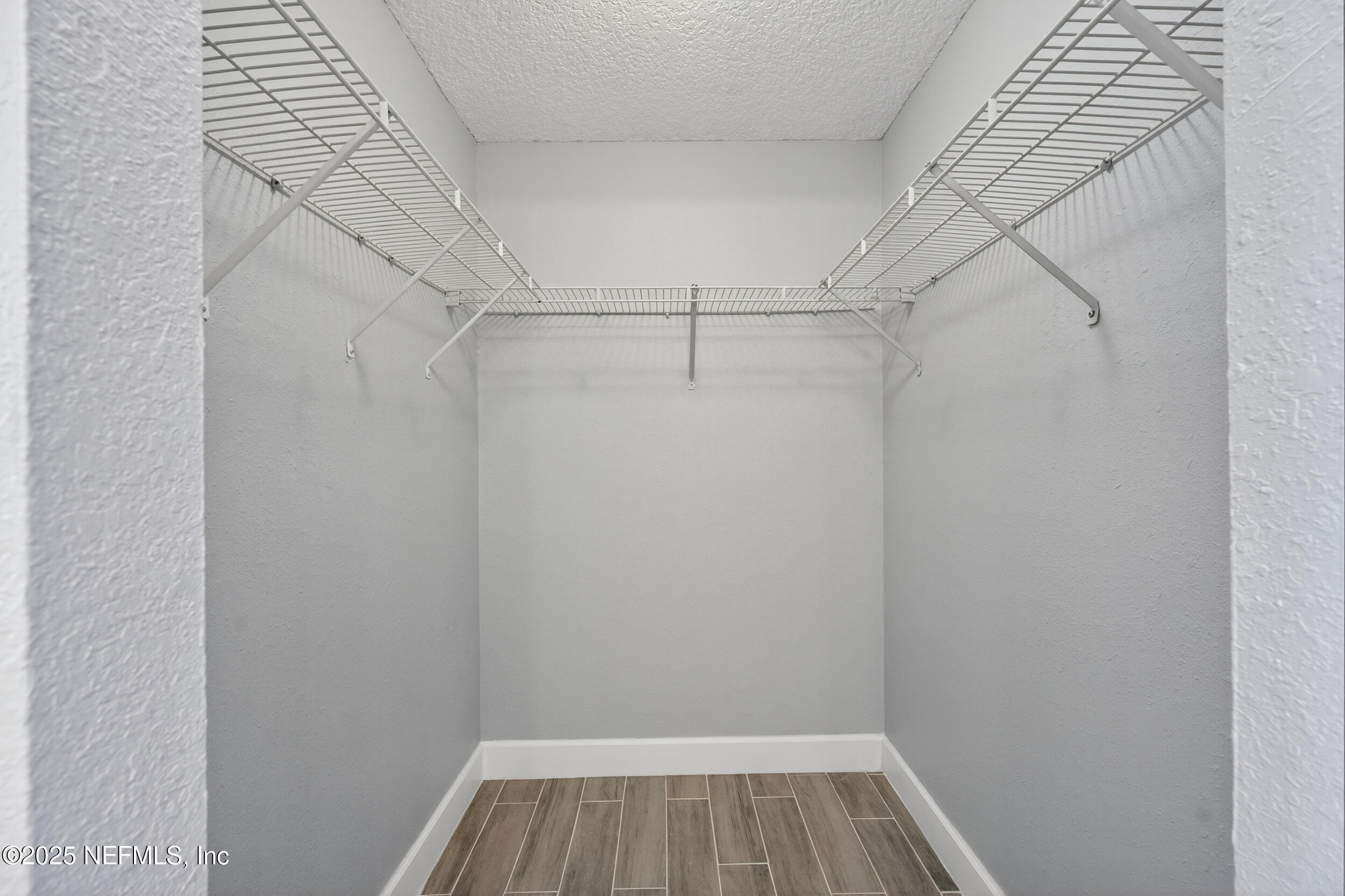 3913 Mission Drive, Unit 4 Jacksonville, FL 32217 - Photo 19 of 26 a view of a room with racks on the wall