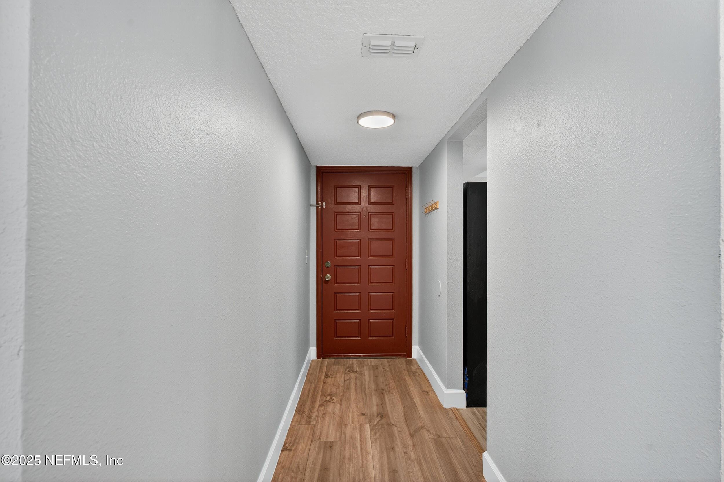 3913 Mission Drive, Unit 4 Jacksonville, FL 32217 - Photo 7 of 26 a view of hallway with wooden floor