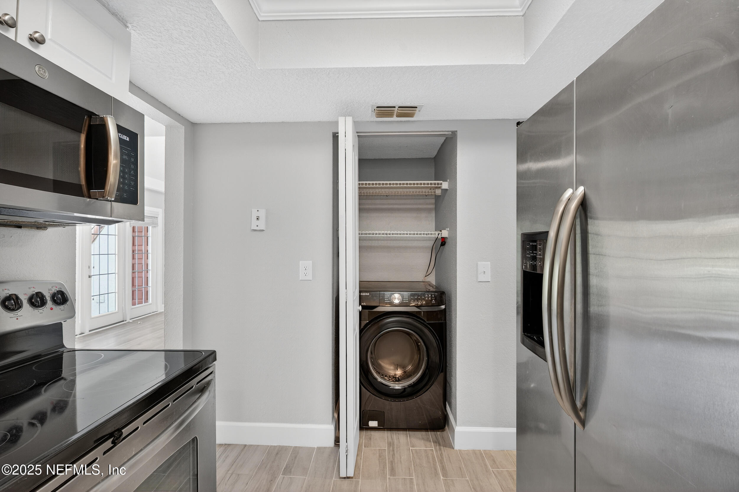 3913 Mission Drive, Unit 4 Jacksonville, FL 32217 - Photo 10 of 26 a view of a kitchen with a sink washer and dryer