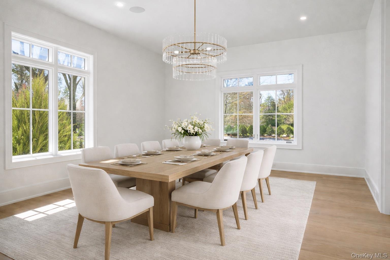 25 West Creek Farms Road Sands Point, NY 11050 - Photo 18 of 39 a dining room with furniture a chandelier and wooden floor