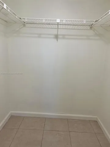 a view of a hallway with closet