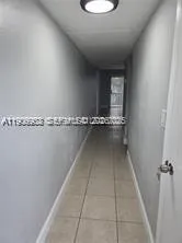 a view of a room with rack on the wall