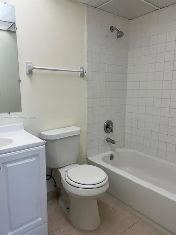 a room with a wooden floor and a sink