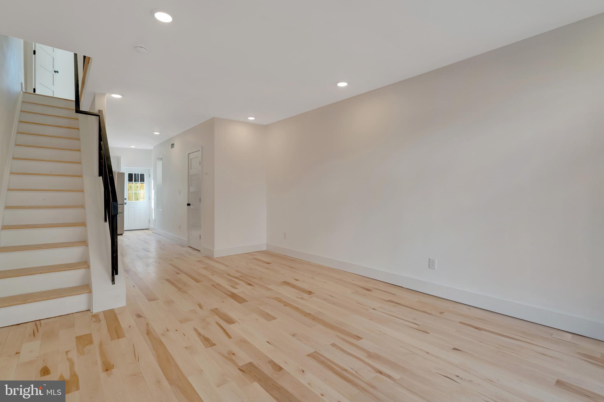 2138 Cross Street Philadelphia, PA 19146 - Photo 4 of 23 a view of hallway with stairs and wooden floor