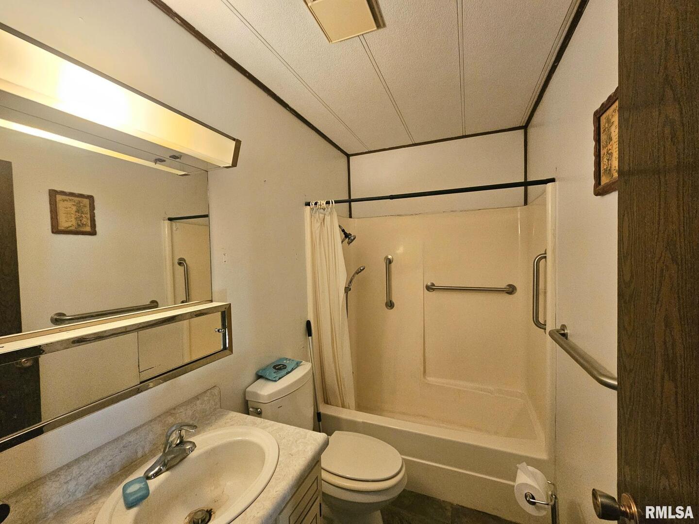 1093 Ocean Avenue Moscow, IA 52760 - Photo 7 of 10 a bathroom with a sink toilet and shower