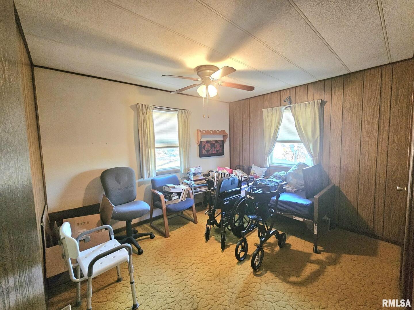 1093 Ocean Avenue Moscow, IA 52760 - Photo 9 of 10 a living room with furniture and a large window
