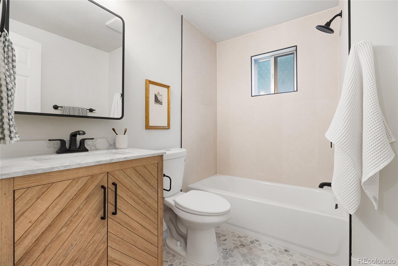 96 Moose Road Lyons, CO 80540 - Photo 19 of 39 a bathroom with a sink a toilet and a bathtub