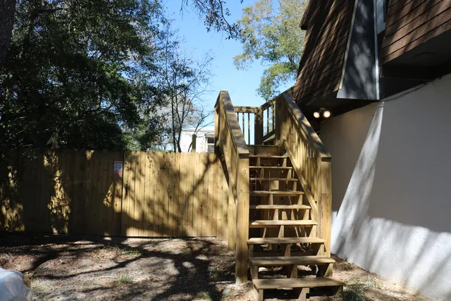 a view of balcony with wooden floor