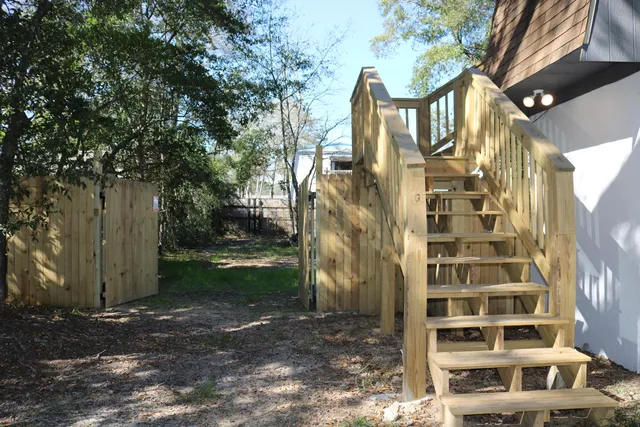 a front view of a residential apartment building with a yard
