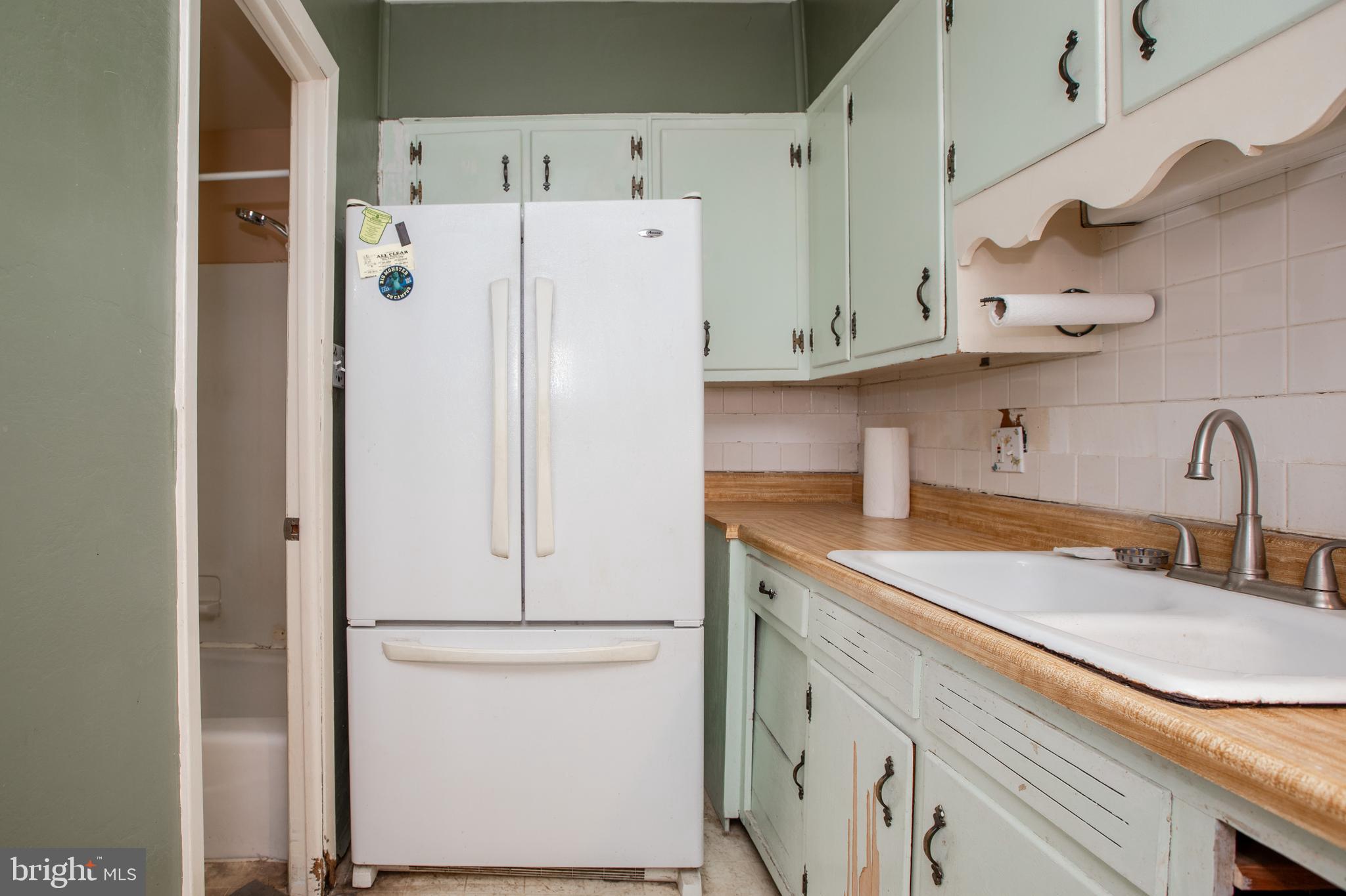 1530 Riverside Drive Trenton, NJ 08618 - Photo 13 of 36 a kitchen with stainless steel appliances a refrigerator and a sink