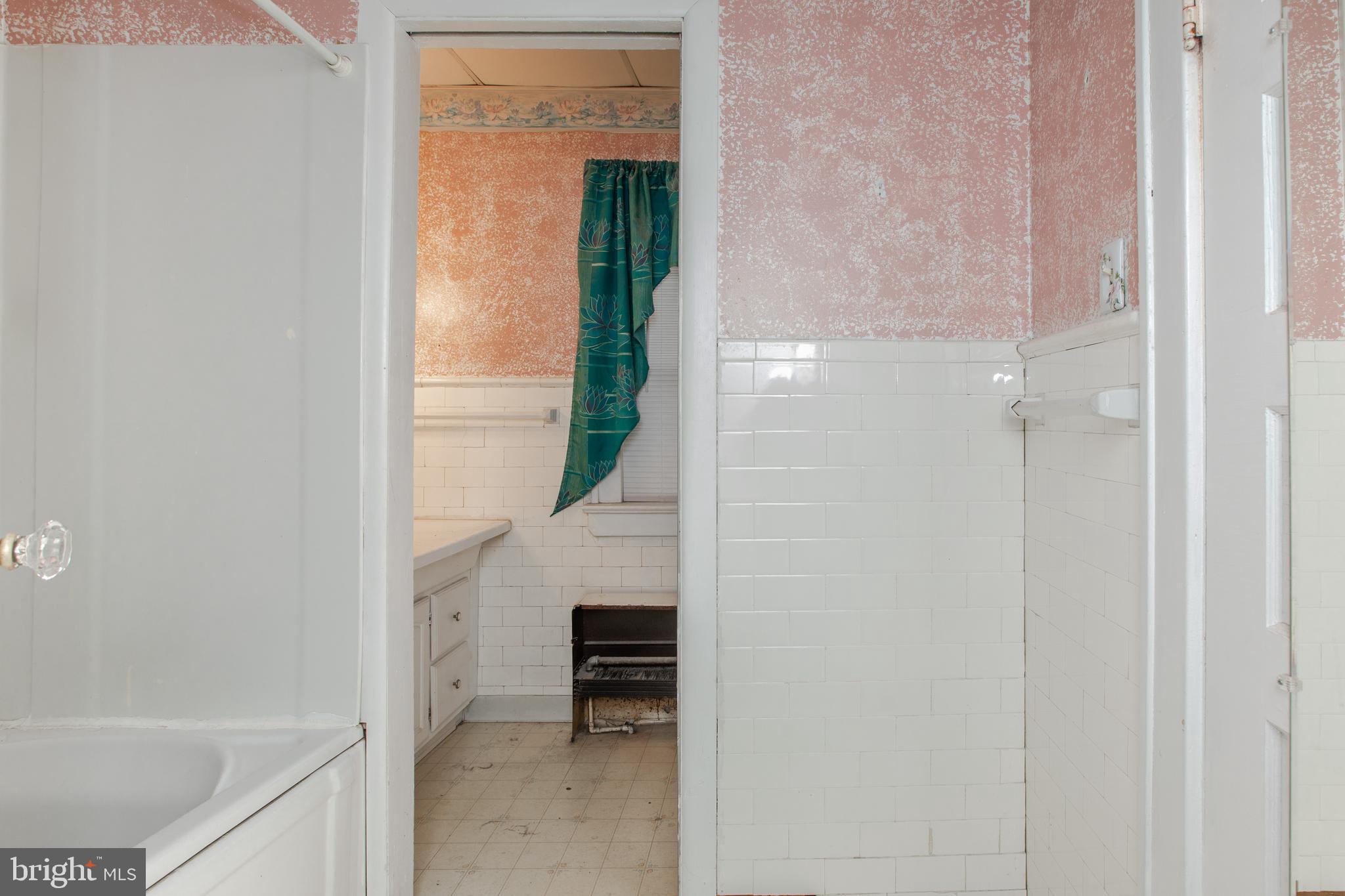 1530 Riverside Drive Trenton, NJ 08618 - Photo 21 of 36 a bathroom with a shower and a sink