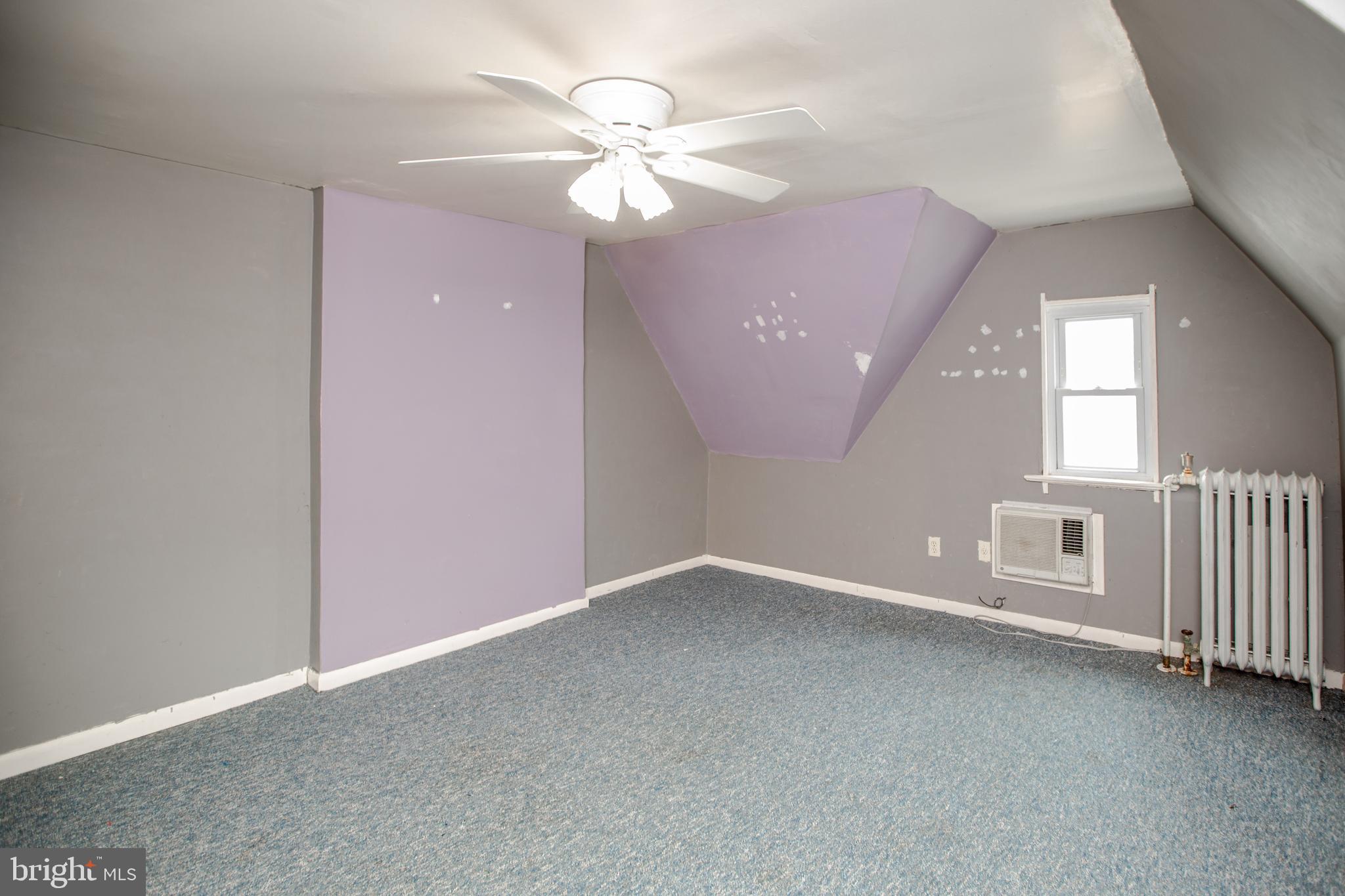 1530 Riverside Drive Trenton, NJ 08618 - Photo 28 of 36 an empty room with chandelier fan and windows
