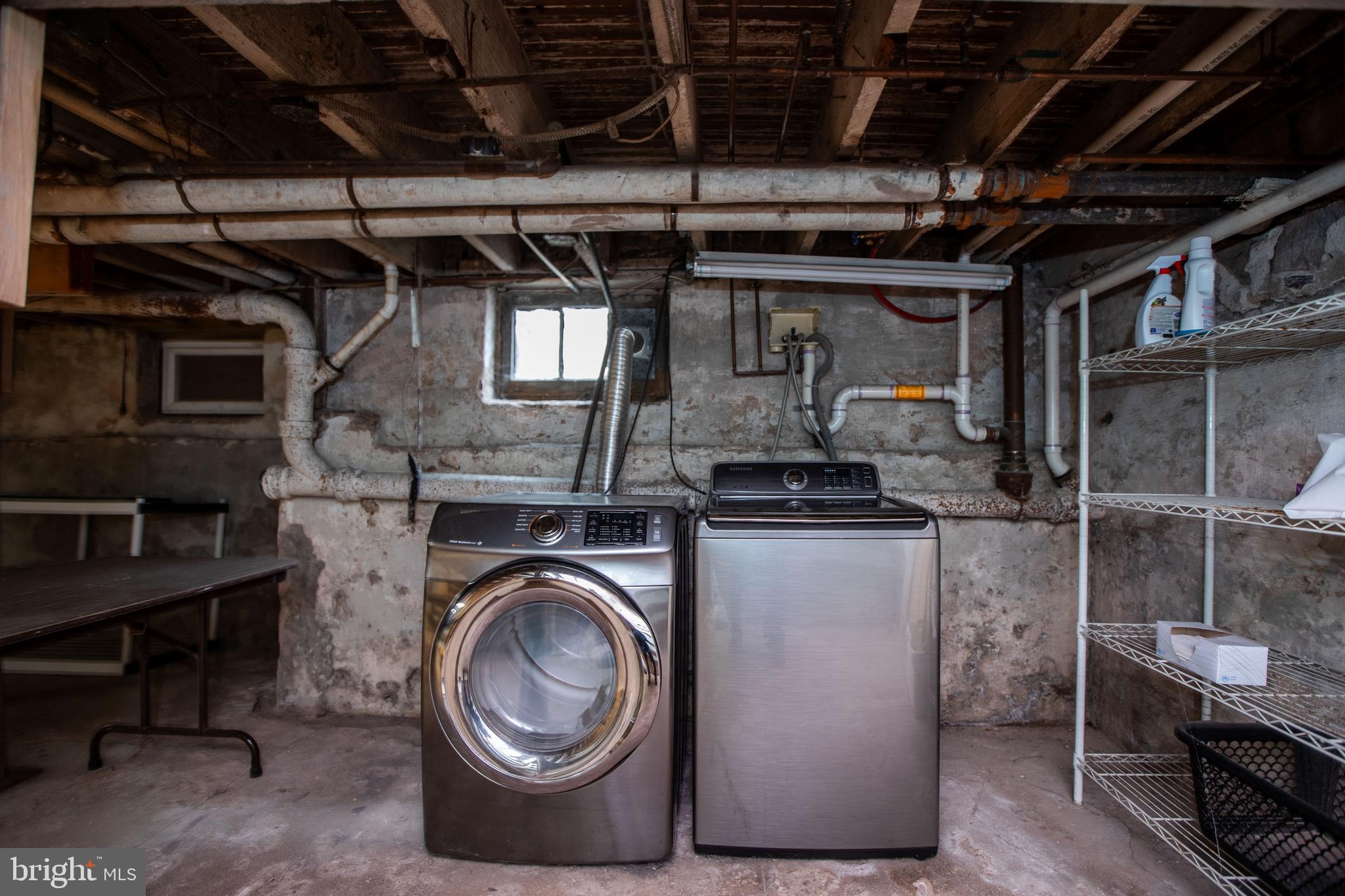 1530 Riverside Drive Trenton, NJ 08618 - Photo 32 of 36 a utility room with cabinets dryer and washer