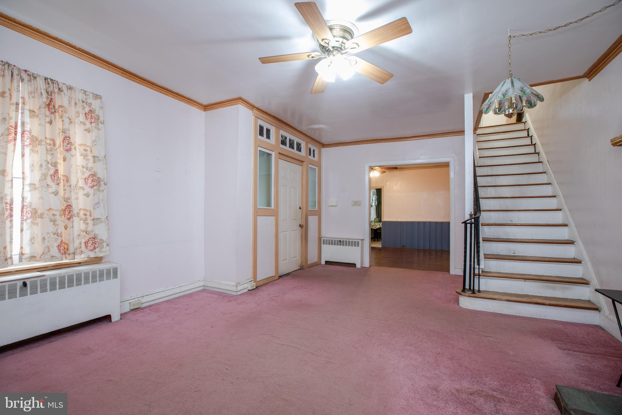 1530 Riverside Drive Trenton, NJ 08618 - Photo 5 of 36 an empty room with windows and fan