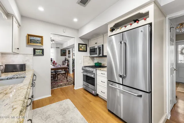a kitchen with a table and chairs in it