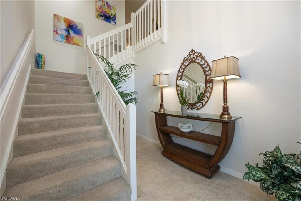 203 Via Perignon, Unit 24 Naples, FL 34119 - Photo 11 of 26 Entry way with natural light from skylight