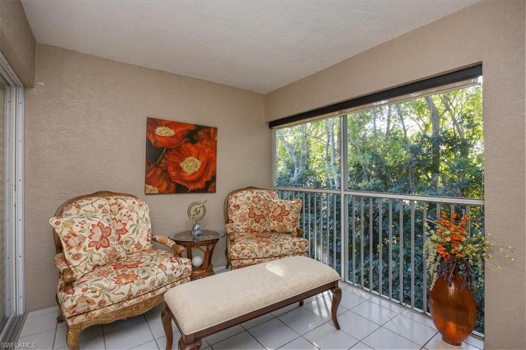 203 Via Perignon, Unit 24 Naples, FL 34119 - Photo 25 of 26 Lanai which leads to the primary bedroom quiet & peaceful