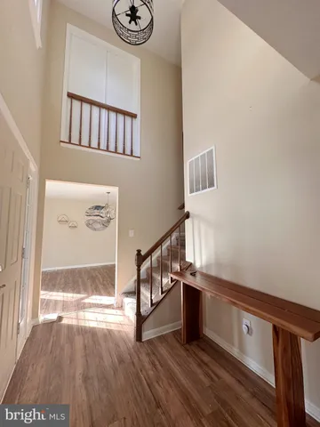 a view of an entryway with wooden floor
