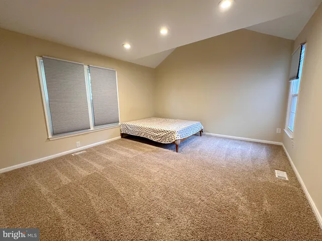 a view of room with a ceiling fan