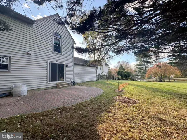 a view of a backyard of the house