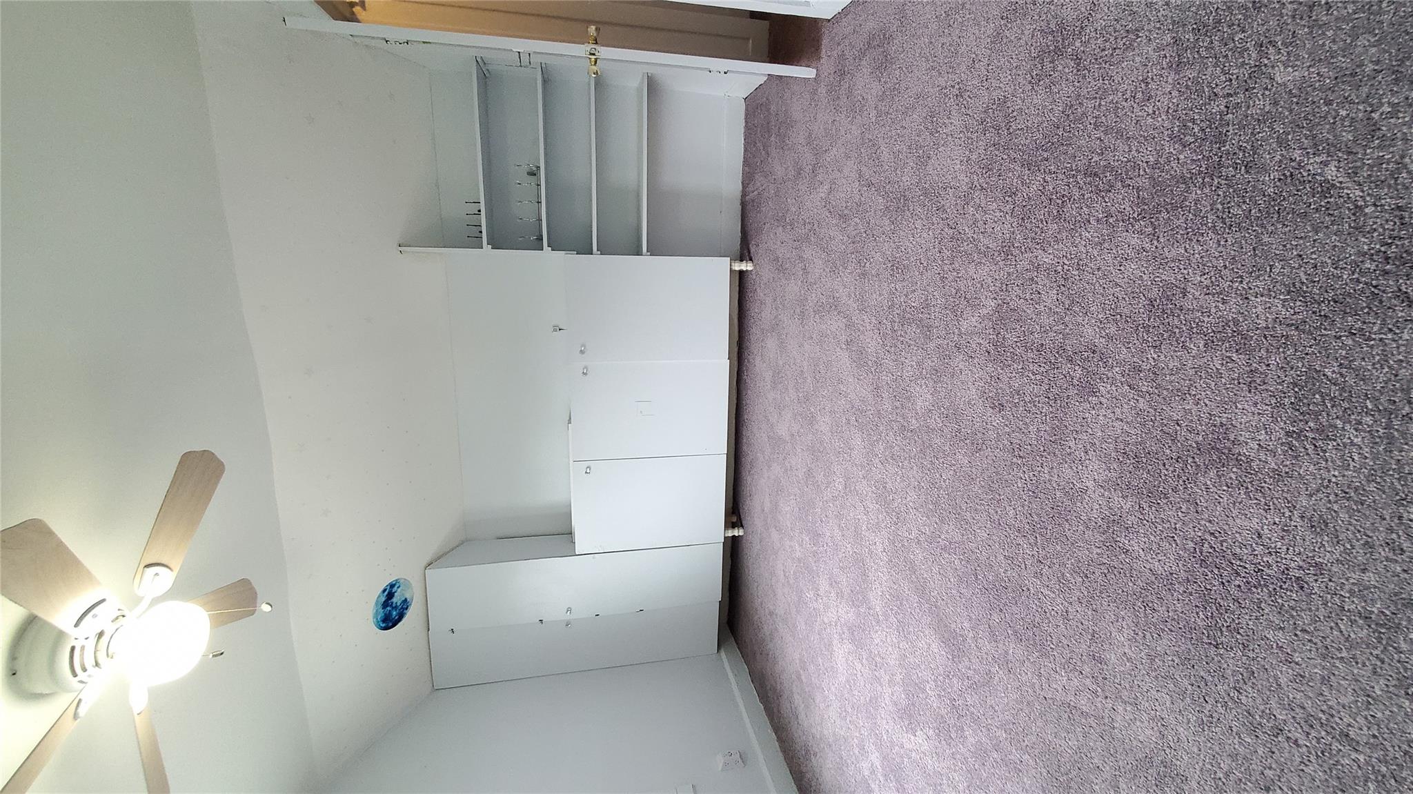 144-49 166th Street Queens, NY 11434 - Photo 11 of 15 Unfurnished bedroom with carpet floors and a ceiling fan