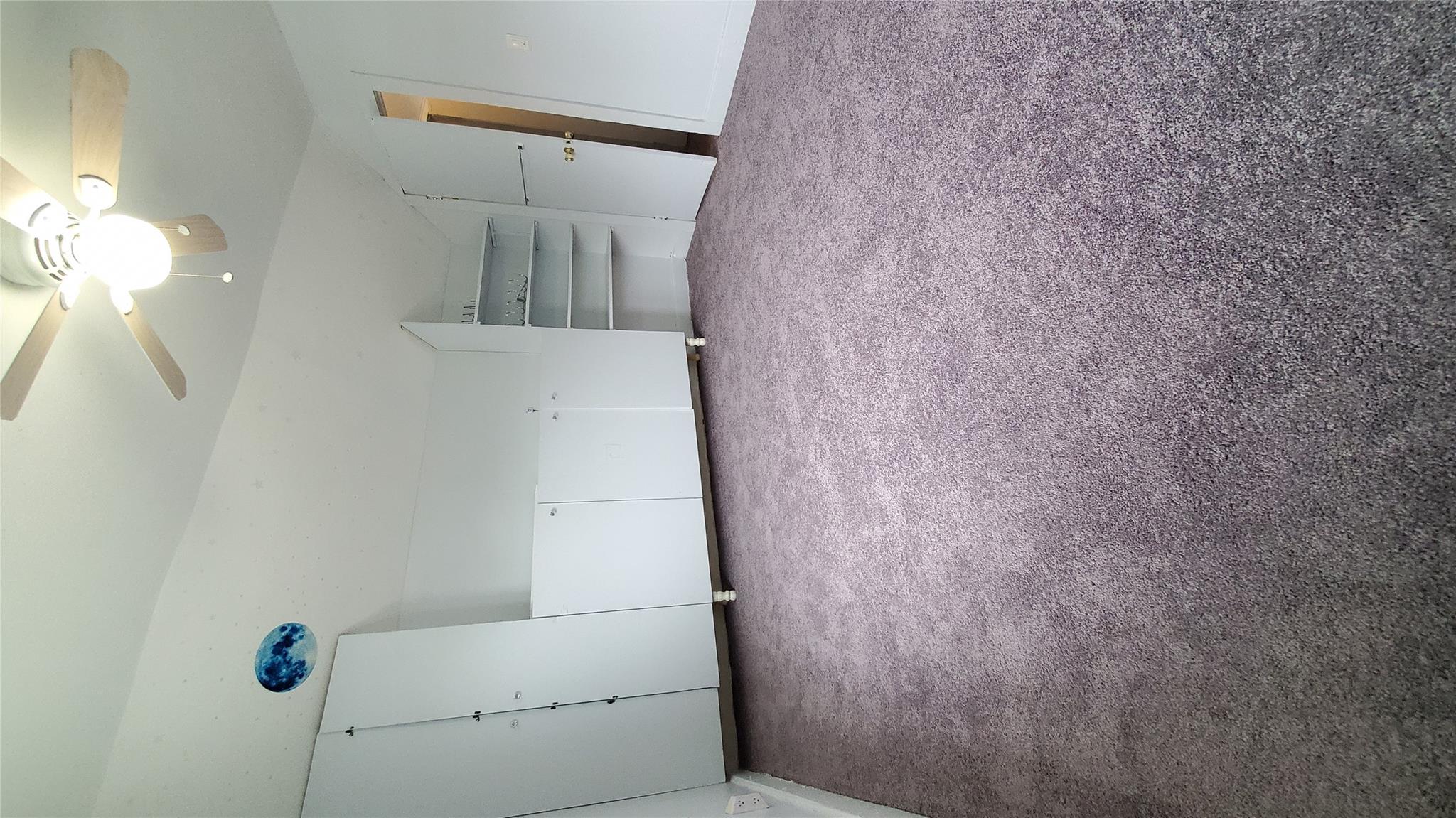 144-49 166th Street Queens, NY 11434 - Photo 12 of 15 Unfurnished bedroom featuring lofted ceiling, carpet flooring, and ceiling fan