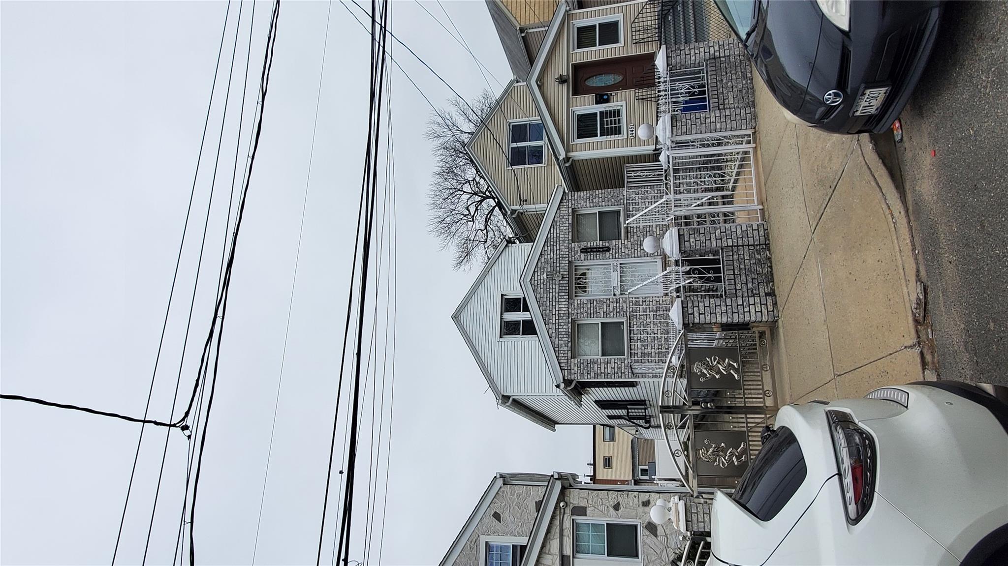 144-49 166th Street Queens, NY 11434 - Photo 15 of 15 View of front of home featuring a gate and a fenced front yard