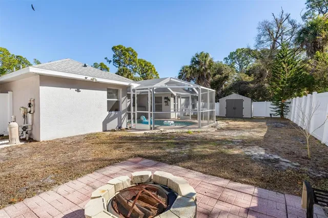 a view of a house with a tree
